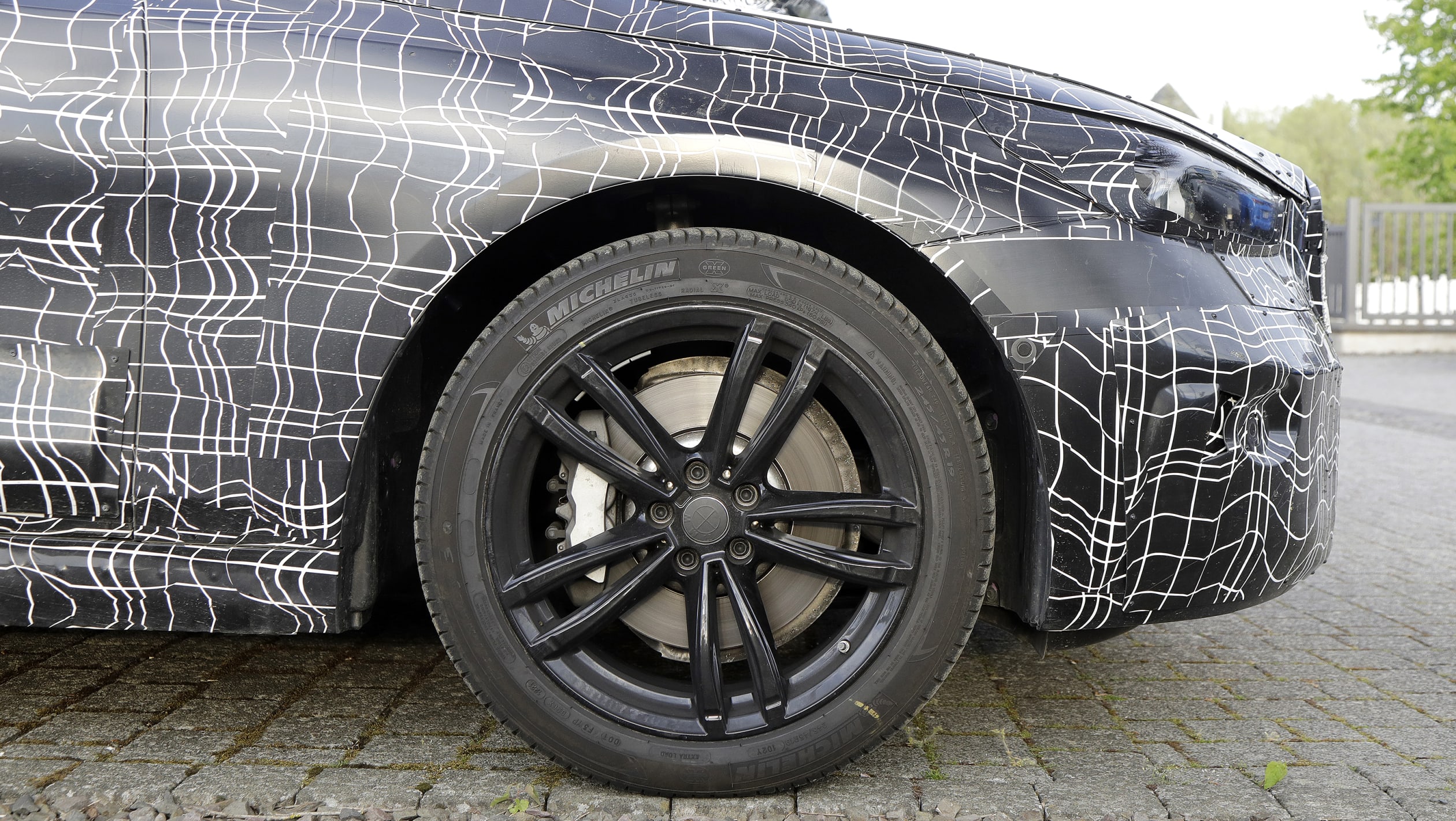 2023 BMW 5 Series (camouflaged) - front o/s wheel